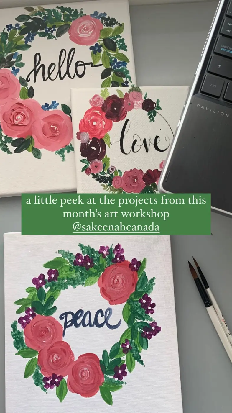 Floral wreath paintings reading hello, love and peace from an early art workshop