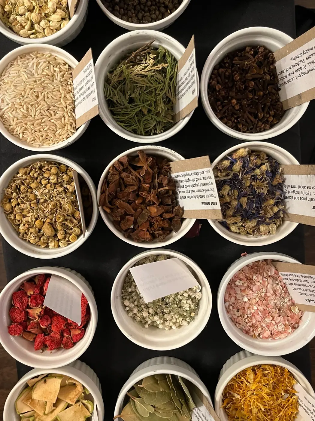 Bowls of dried herbs and flowers at a Create for a Cause workshop