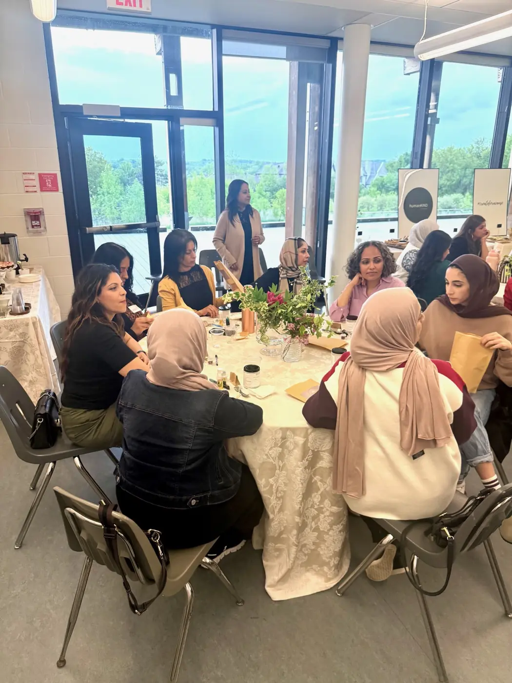 Guests creating together around round tables