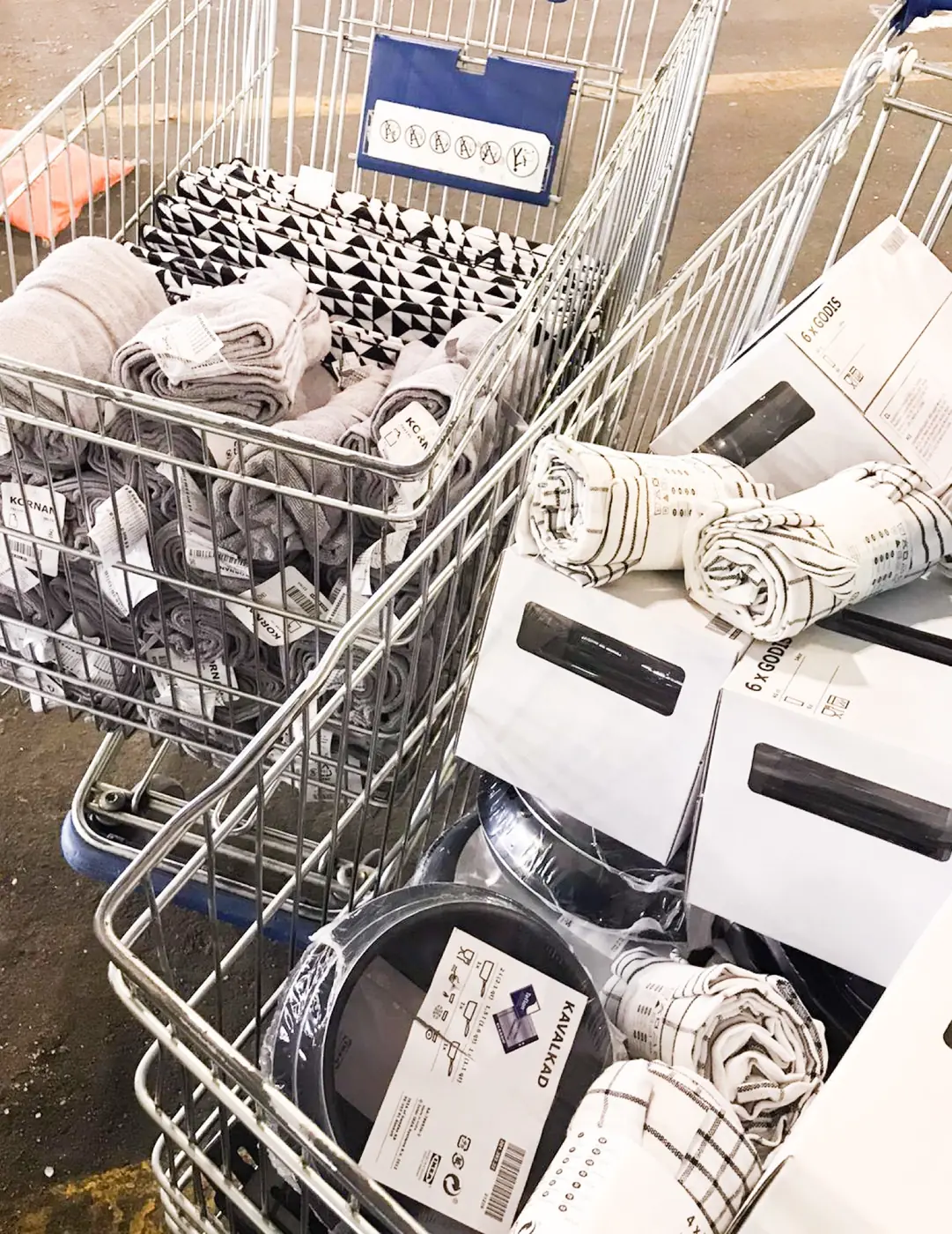 Shopping carts full of new towels and bedding for Gift of Hope boxes