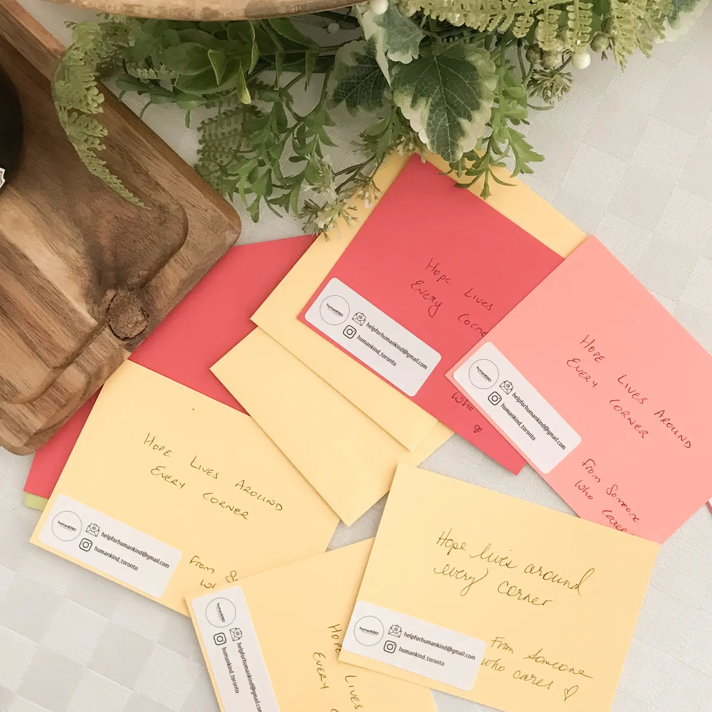 Handwritten notes of encouragement in colourful envelopes