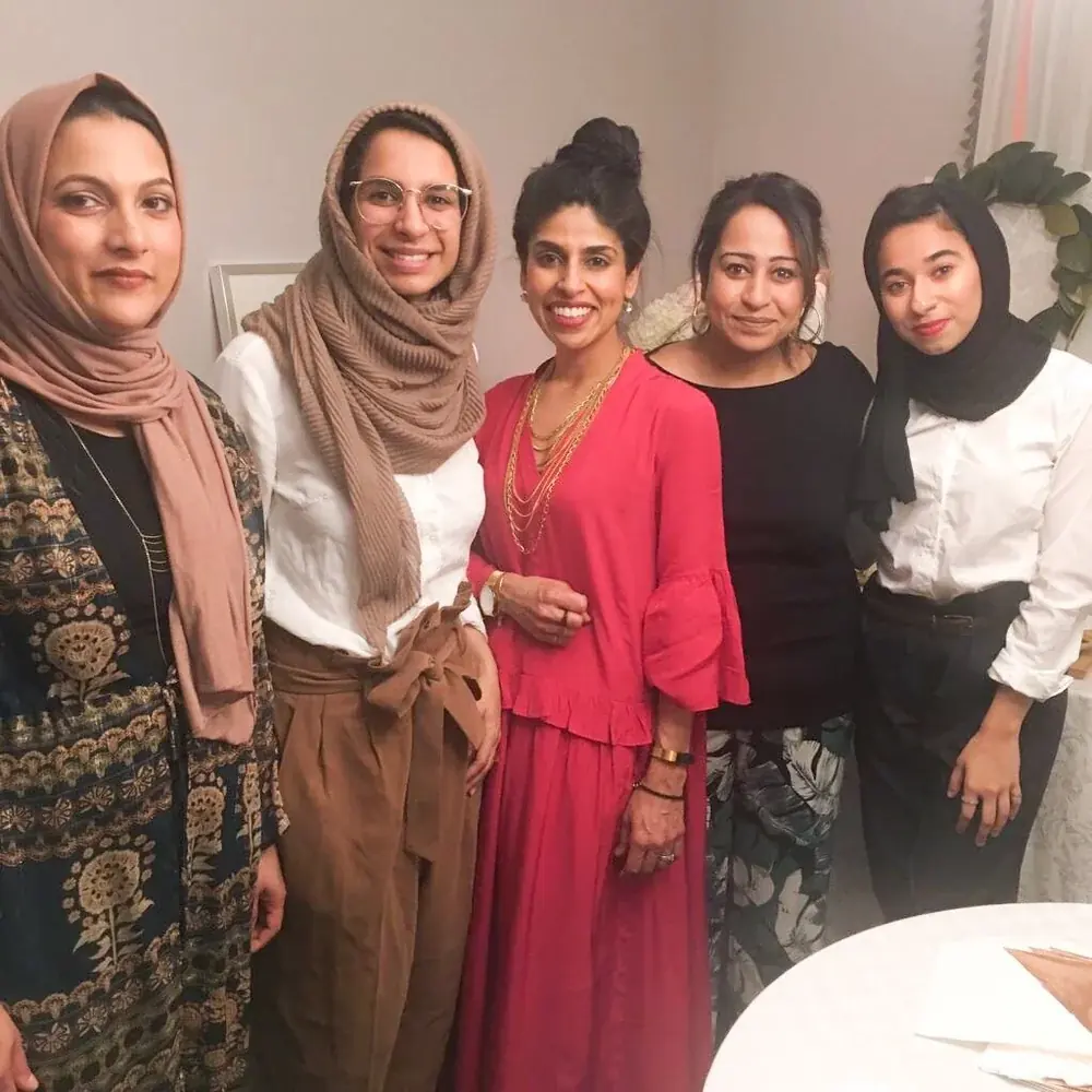 Five women smiling together at the first Create for a Cause