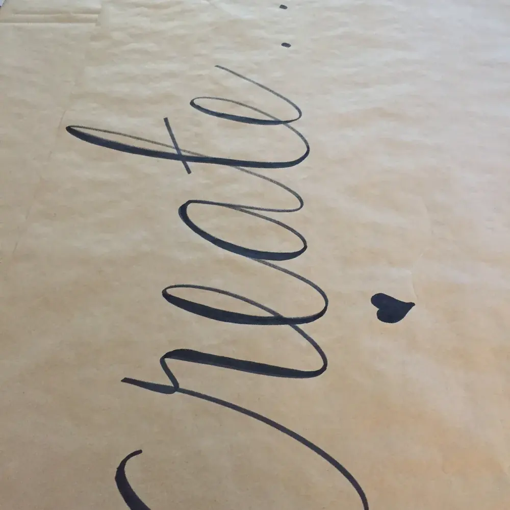 The word create written in calligraphy